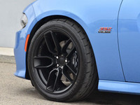 The 2023 Dodge Charger Scat Pack 392 in striking blue with a robust rear-wheel drive offers a dynami... (image 8)