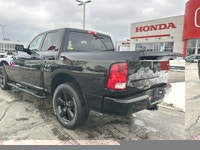 This striking 2023 Ram 1500 Classic SLT Crew Cab Pickup in Diamond Black Crystal Pearl with a Diesel... (image 7)