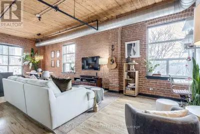 Welcome to Suite 406 at the iconic Knitting Mill Lofts - a rare penthouse corner residence in one of...