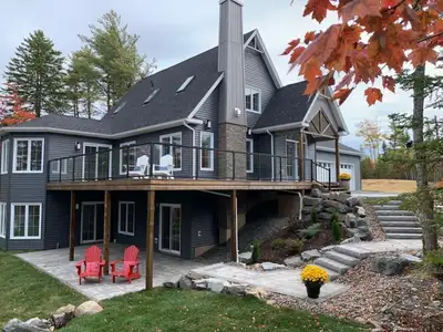 MAGNIFICENT LAKE FRONT HOME, resting on over an acre of land (located two doors down from the QEII D...