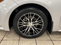 Dawn paints the streets in quiet silver as the 2021 Toyota Corolla L slips from the curb, its LED be... (image 8)