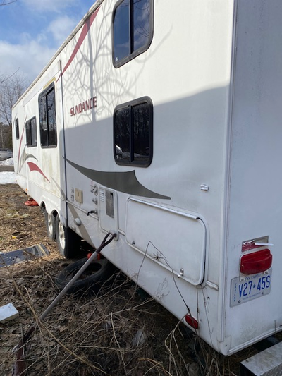 30 FOOT TRAILER NEED WORK INSIDE ROOF AND FLOOR SOLID, SEE IN BROCKVILLE. TIRES AND SPARE GOOD, SOLD...