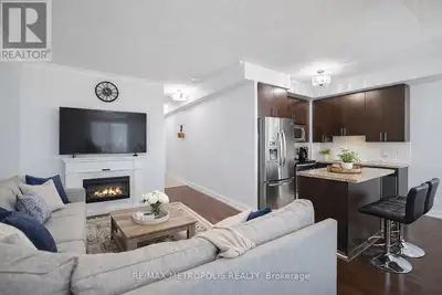 Two-storey penthouse offering approximately 930 sq. ft. of bright, functional living space, two priv...