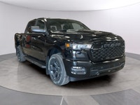 The 2026 Ram 1500 Express 4x4 Crew Cab 57 Box is a powerful yet stylish black truck thats ready for... (image 6)