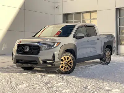 Our 2023 Honda Ridgeline Touring in Sonic Grey with the Honda Performance Development Package is in...