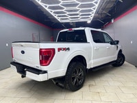 Experience the perfect blend of power and sophistication with the 2022 Ford F-150 XLT, presented in... (image 4)