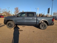 The 2026 Ram 1500 Rebel Crew Cab in Granite Crystal Metallic makes a bold statement with its rugged... (image 2)