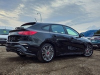 Presenting the 2024 Kia Forte5 GT in a sophisticated Black exterior with a smooth Front-Wheel Drive... (image 1)