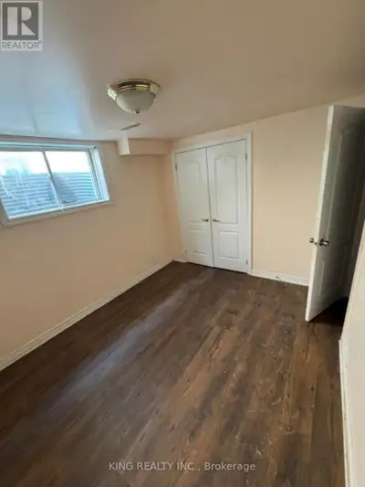 Bright and spacious approx. 1000 sq ft 2-bedroom basement unit with private separate entrance in a q...