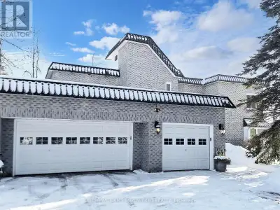 Sitting on a fantastic 1.01 acres in prestigious Woodland Acres, this custom-built estate offers ult...