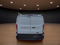The 2023 Ford Transit Cargo Van, clad in a clean white finish and equipped with rear-wheel drive, of... (image 5)