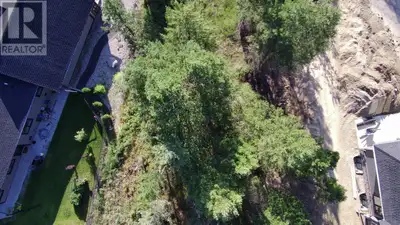 Nestled in a quiet cul-de-sac near Copper Point Golf Course, this stunning treed lot offers the perf...