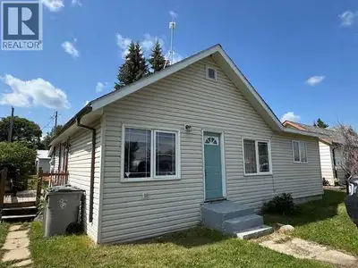 For Sale in Lashburn — Updated 2-Bed + Office with Heated 20' x 24' Garage Move-in ready home with r...