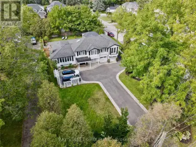Nestled steps from Lake Ontario, this meticulously updated 2-storey executive home blends timeless c...
