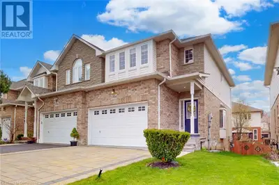 Welcome to this beautifully maintained 3+1 bedroom, 4 bathroom end-unit townhome in the sought-after...