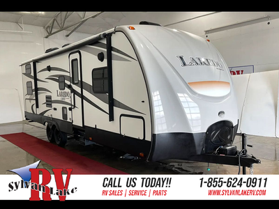 The 2015 Keystone Laredo 28BH is a versatile and spacious travel trailer, designed for families and...