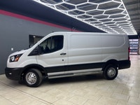 The 2024 Ford Transit Cargo Van T-250 130 Low Rf 9070 GVWR AWD in pristine white is a formidable veh... (image 2)