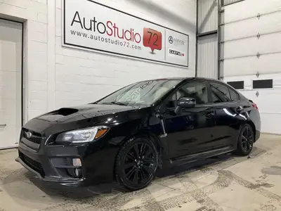 Le Subaru WRX 2017 usagé offert chez AutoStudio 72 à Mirabel propose une conduite manuelle à 6 vites...