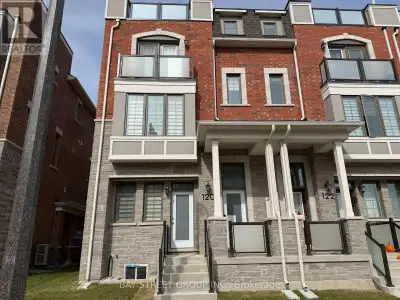 Brand new, never-lived-in freehold townhome with a double-car garage, ideally situated at Woodbine A...
