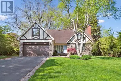 Charming family home in the exclusive Morrison neighborhood, tucked away on a private, oversized lot...