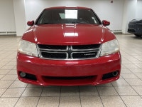 A red 2011 Dodge Avenger SXT easing through the day has a way of making routine driving feel more de... (image 7)