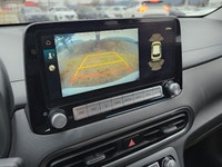 Welcome to a new era of driving with the 2023 Hyundai Kona Electric Ultimate in a pristine white fin... (image 8)