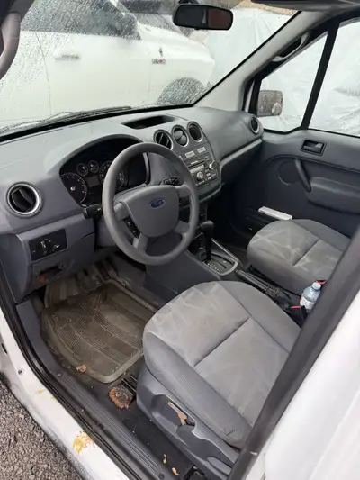2010 Ford Transit Connect XLT Cargo Van with 105,000KM. Sold as is.