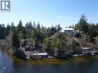 One of the best views on Cluculz Lake! This charming open-concept waterfront cabin sits on a private...