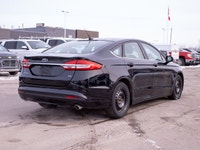 This 2017 Ford Fusion SE is powered by a reliable 2.5L four-cylinder engine paired with a smooth aut... (image 7)