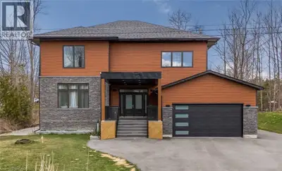 Stunning 5-year-old home built on 100 ft. wide lot features space, modern design and functionality....