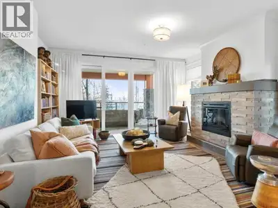 Welcome to this stunning main-floor condo offering breathtaking river and mountain views from every...