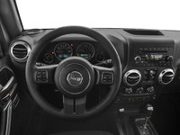 The 2018 Jeep Wrangler JK Unlimited Rubicon in stunning white with an all-wheel-drive system invites... (image 7)