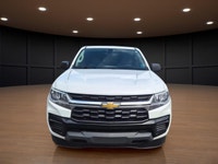 The 2022 Chevrolet Colorado 2WD Work Truck in striking white is the ultimate workhorse for anyone ne... (image 1)