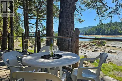 Discover the rustic charm of this rare south-facing, walk-on waterfront property in Maple Bay on Las...