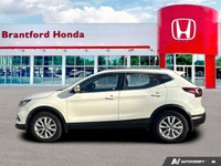 Ready for daily adventures? This 2023 Nissan Qashqai Sport Utility, in sleek White, is engineered fo... (image 1)