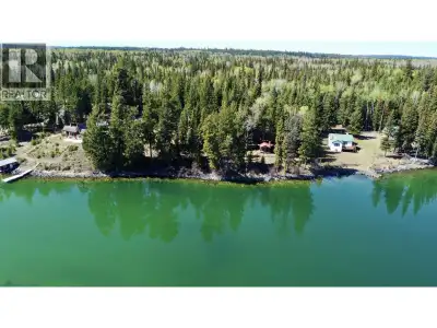 Rare find on Sheridan Lake featuring over 200 ft of eastern-exposed waterfront on just over 4 acres!...