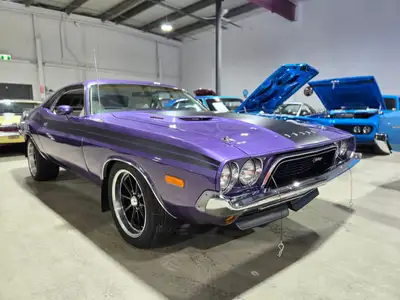 1973 Dodge Challenger Rallye in Plum Crazy Purple with Satin black side stripes and hood treatment!...