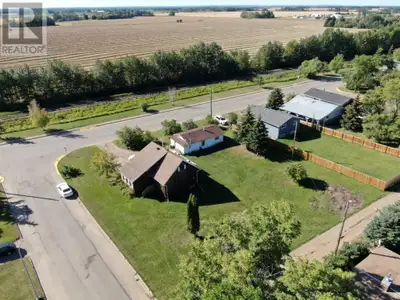 Three properties One Price! Unique opportunity with this 1.5 Storey home located on its own lot and...