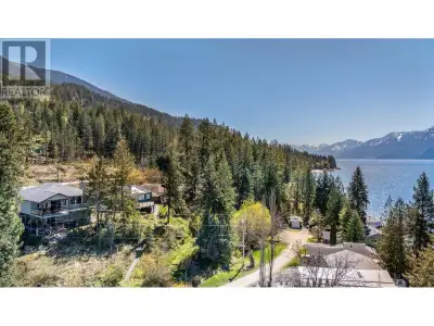 Stunning 4-bedroom, 3-bath home sits in the tranquil East Shores Properties community on Kootenay La...