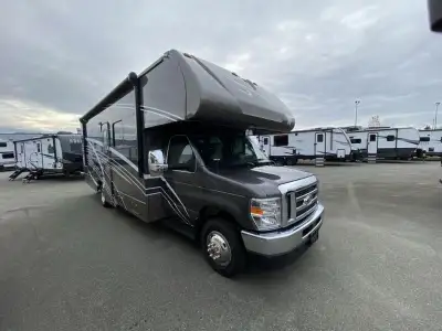 Winnebago Minnie Winnie Class C gas motorhome 26T highlights: Private Bedroom Bunk Over Cab U-shaped...