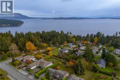Nestled in the unbeatable location of Mill Bay on a private .62 acre parcel surrounded by mature hed...