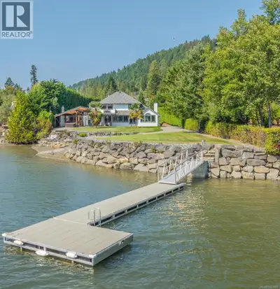 Waterfront Paradise Acreage: 2 Homes and Shop with Business & Income Potential! Welcome to your drea...