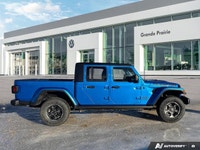 Conquer every landscape in this 2023 Jeep Gladiator Rubicon, gleaming in Hydro Blue Pearl. With only... (image 5)