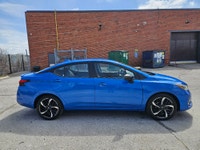 Buckle up, because this 2023 Nissan Versa SR CVT in Electric Blue Metallic isnt just a carits your t... (image 7)