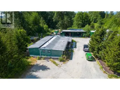 LOCATION! Amazing Investment Potential. Almost 5 flat acres on Lougheed Highway with huge frontage....