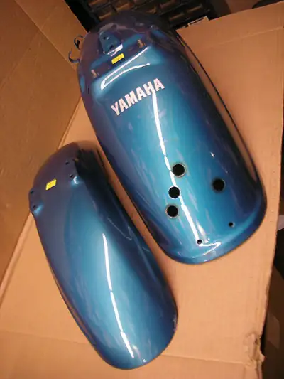 Have front and rear fenders in a greenish / blue colour they are off of a 1994 XV 1100 Yamaha Virago...