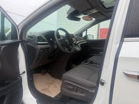 A spacious family minivan with comfortable seating, advanced safety features, and practical convenie... (image 8)