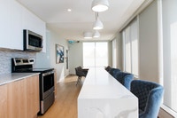 **Upgraded suites available which include high gloss white cabinetry and quartz countertops. In-suit... (image 3)