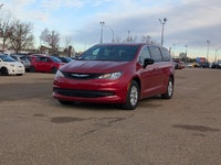 The 2026 Chrysler Grand Caravan SXT in Red Hot Pearl with a Black interior offers a bold look, spaci... (image 1)
