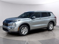 Introducing the 2026 Mitsubishi Outlander Plug-In Hybrid SE S-AWC, gliding in with a captivating sil... (image 2)